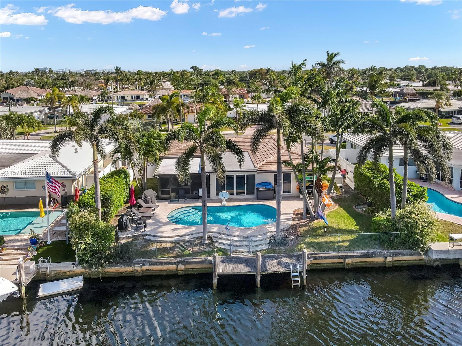 Beautiful waterfront home in a great neighborhood on a rare wide canal with amazing views. Relax in 