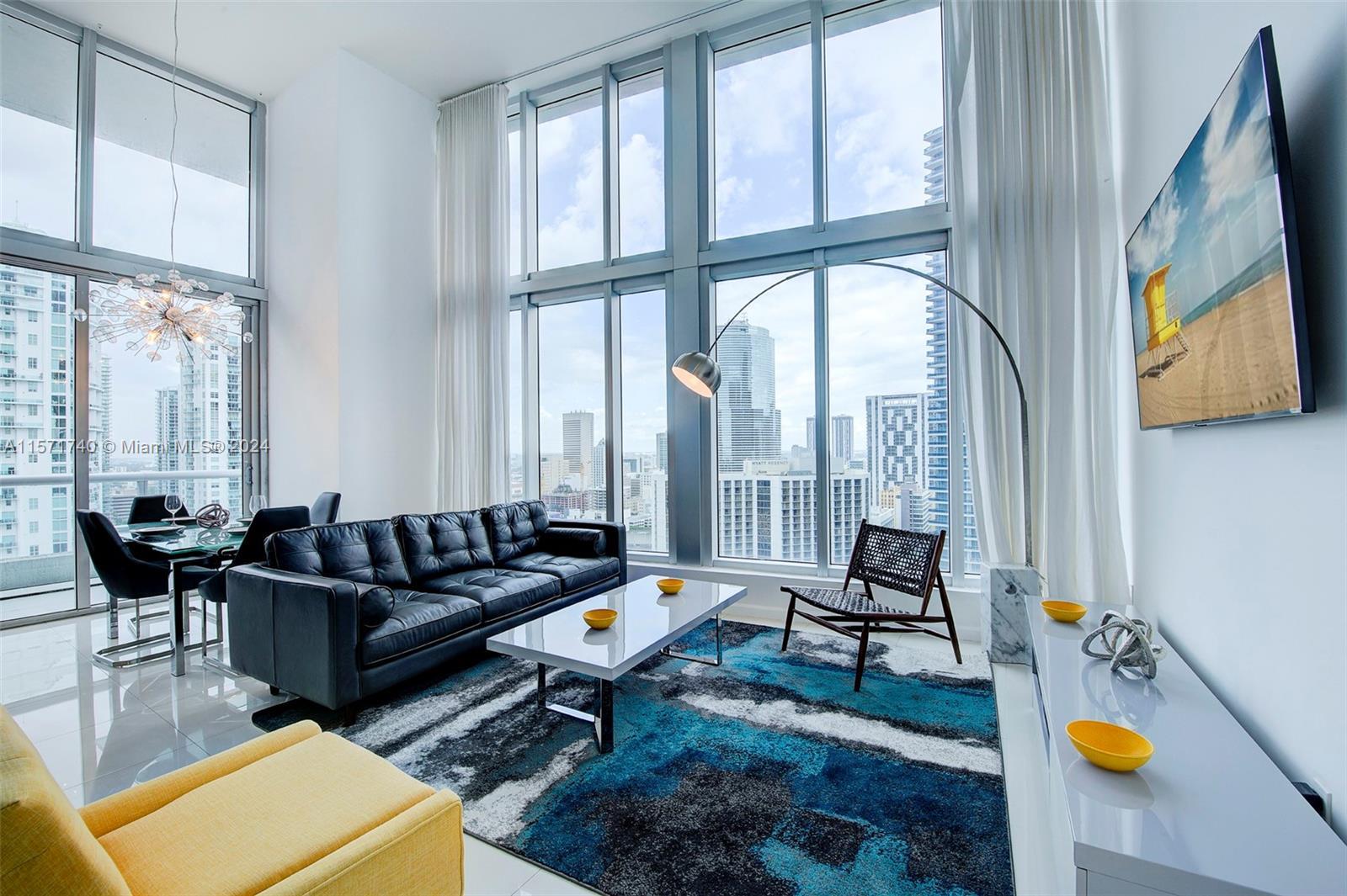 Rare 2/2 NE Corner Unit at Icon Brickell with 16ft. Double-height ceilings, Bay, and Ocean Views. Sh