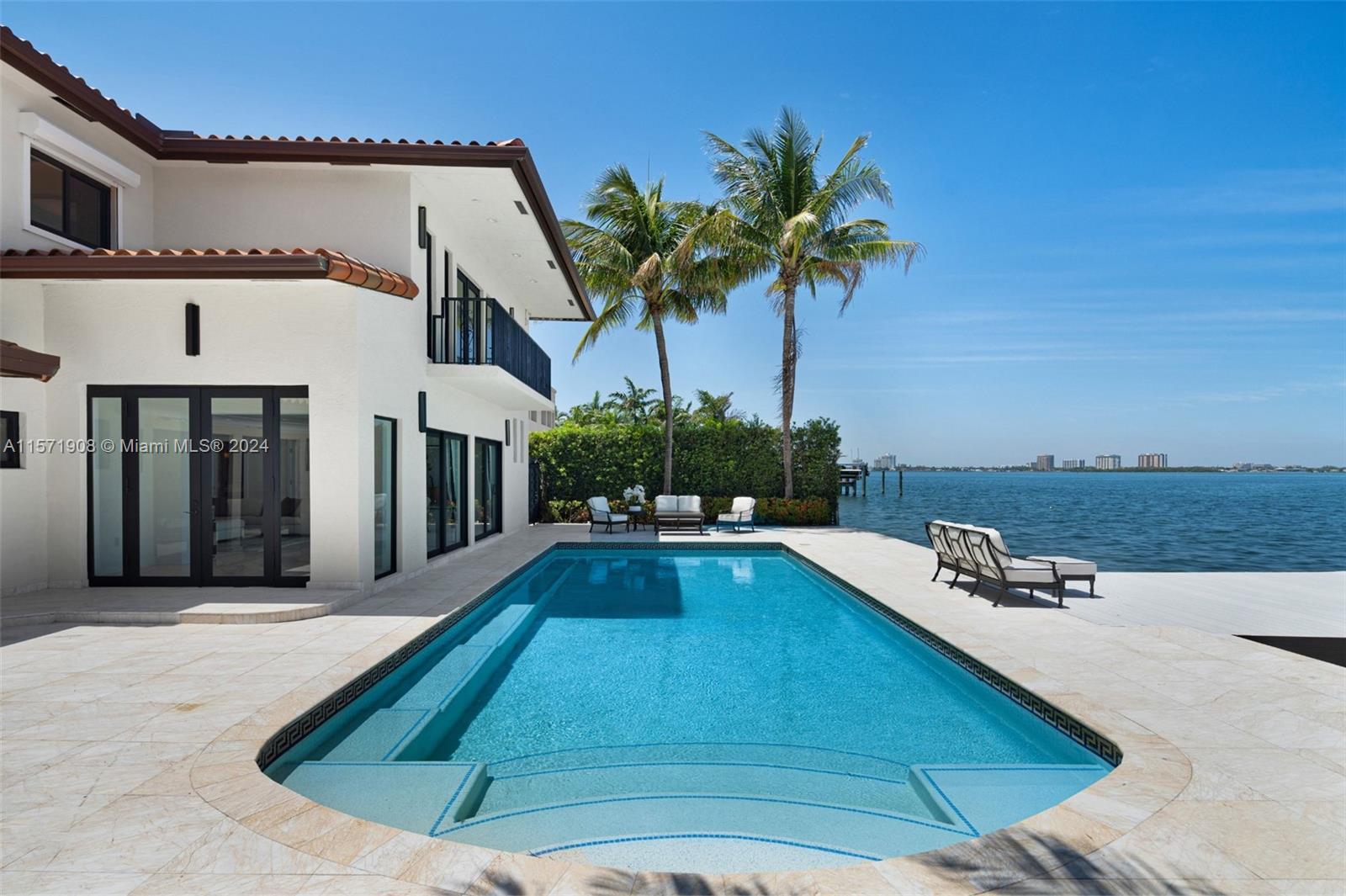 Step Inside With Me! This Mediterranean abode in the beloved Biscayne Point offers open bay views in