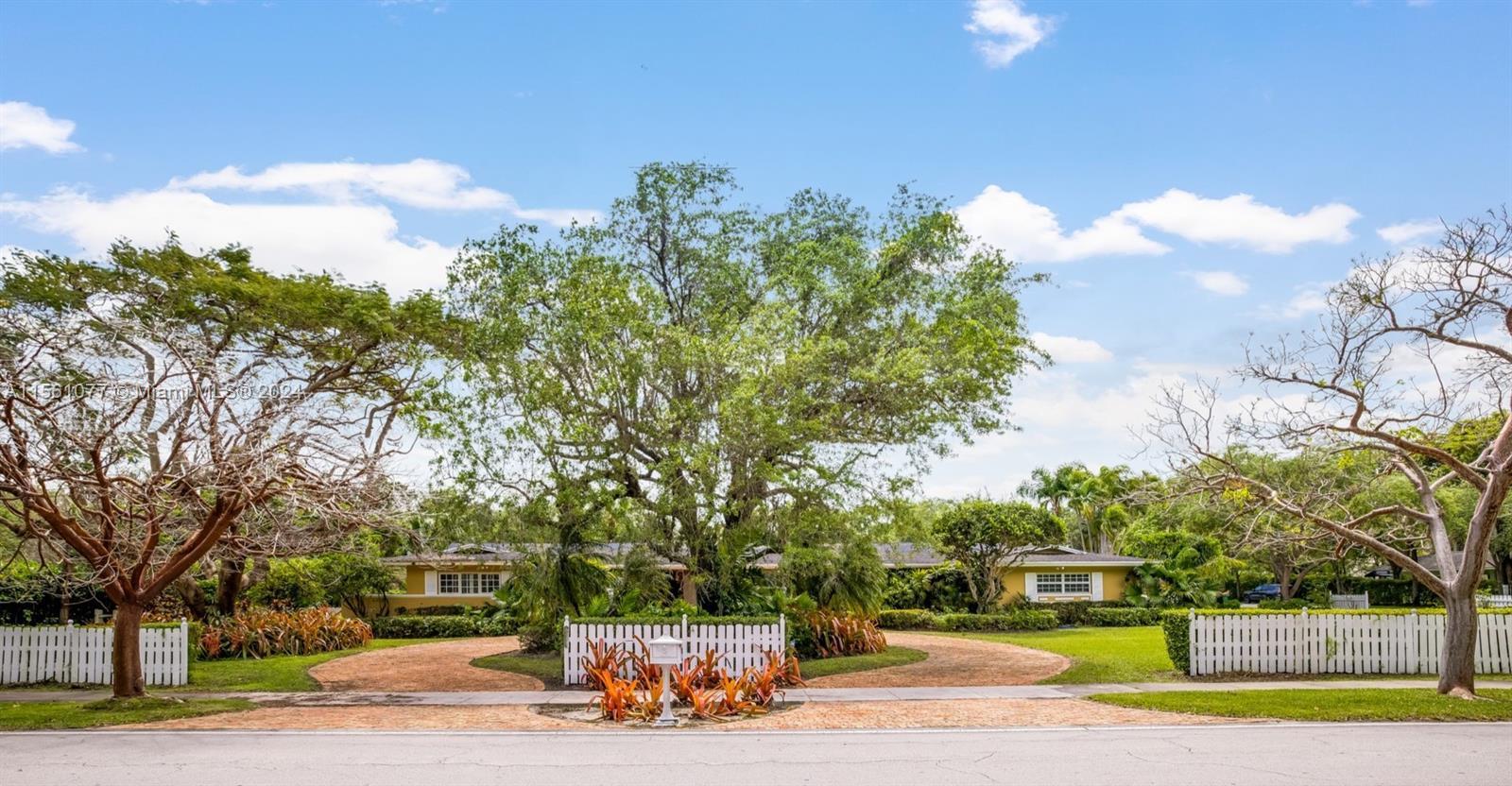 The perfect family home, sitting on an oversized 32,000+ sf. CORNER lot in the heart of Pinecrest. Y