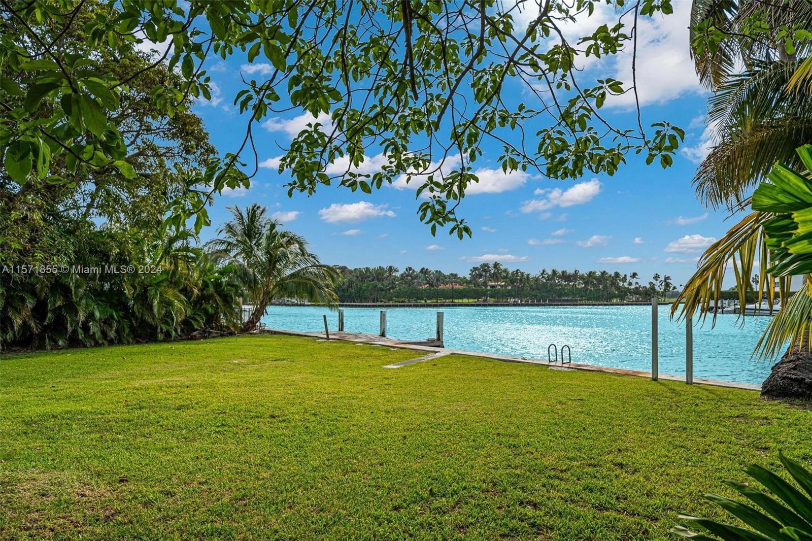Live on highly sought-after Bay Drive! This gorgeous oversized single waterfront lot +/- 10,250 SF a