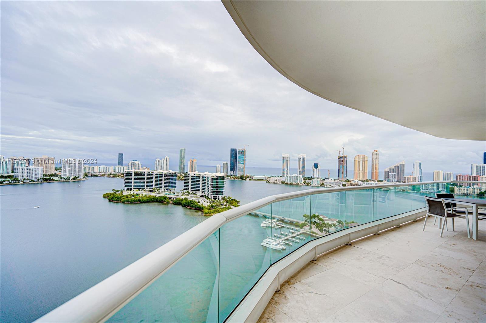 ENJOY MAGNIFICENT VIEWS FROM THIS 28TH FLOOR FACING THE BAY, SUNNY ISLES AND THE OCEAN, WHILE ENJOYI