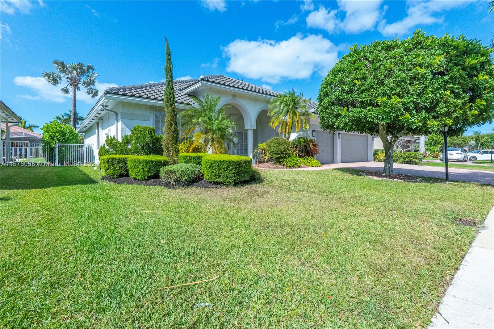 Located in the prestigious Boca Falls community, this stunning 4BR/3BA home offers luxury and a fami