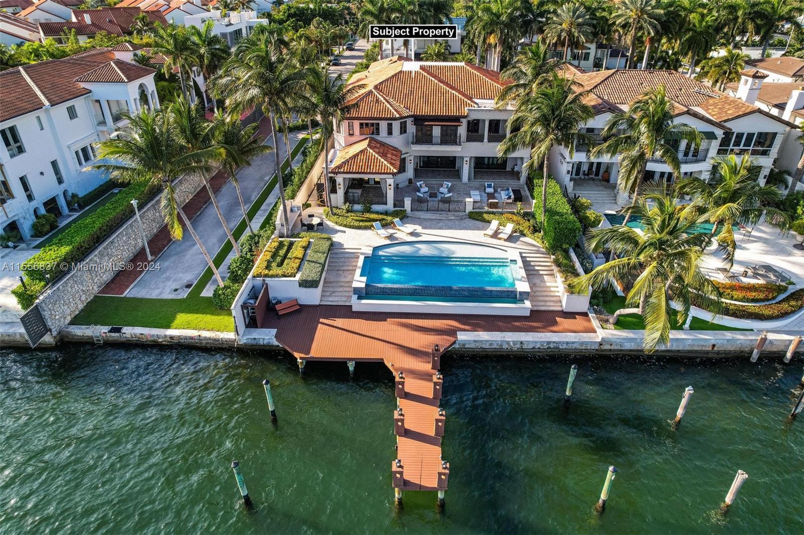 Spectacular Mediterranean home with incredible unobstructed views of Biscayne Bay. This 2-story wate