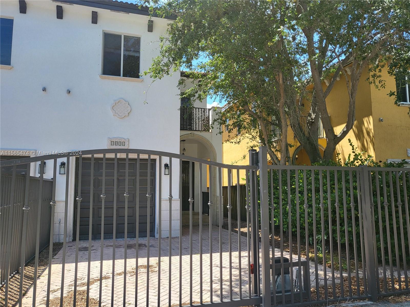 Coconut grove town house, large living area with lots of windows, stainless steal appliances, cookin