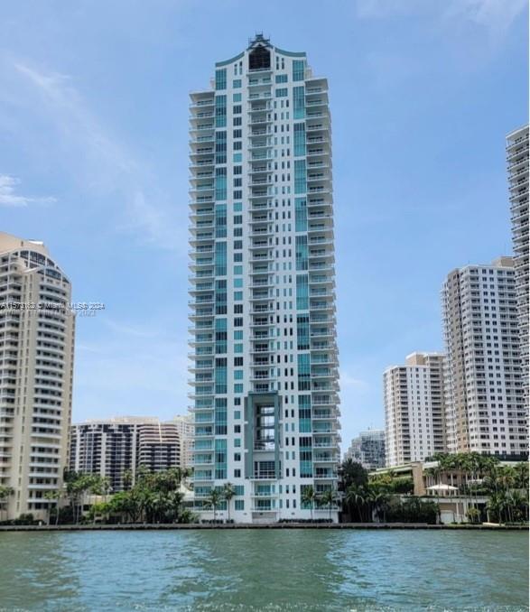 Set in the world-class gated island of Brickell Key. This 2/2.5 split floor plan unit at the most pr
