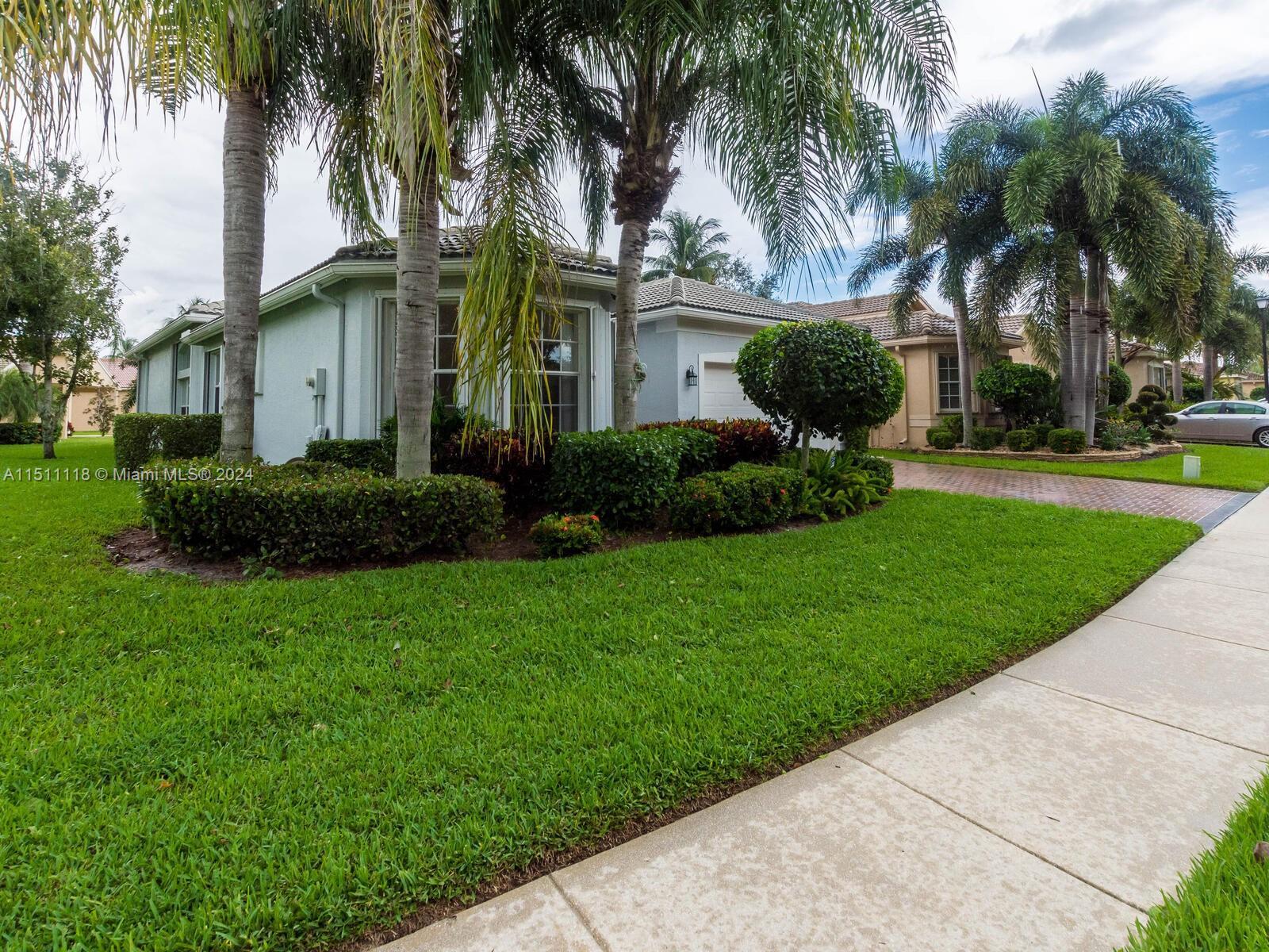 Immerse Yourself in Lakeside Tranquility

This South Florida residence blends style, comfort, and 