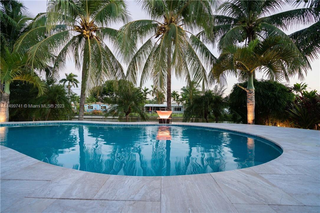 This waterfront pool home sits on a cul-de-sac just two miles from Hollywood Beach. Italian marble w
