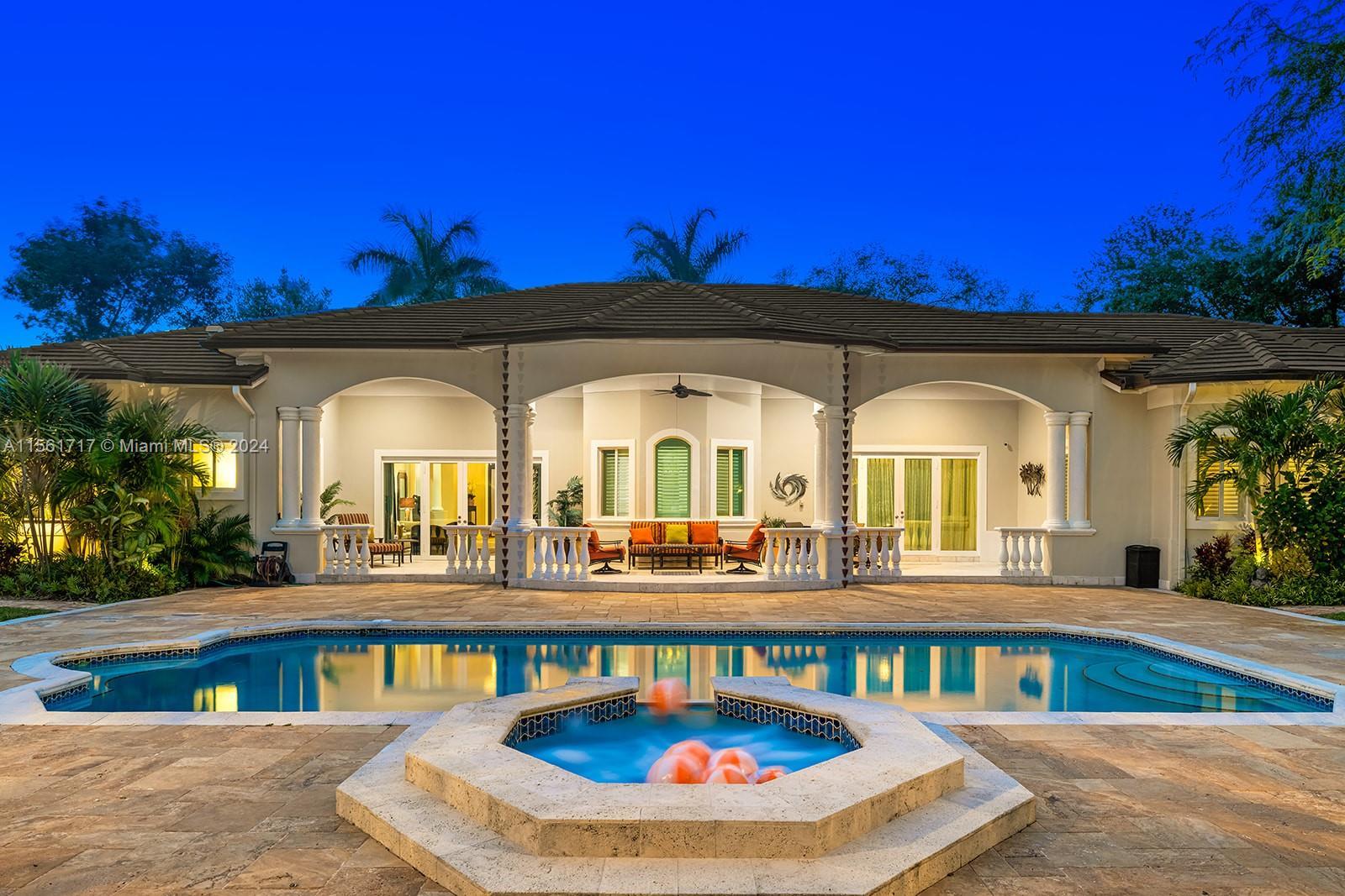 Exceptional estate nestled on a rarely available corner acre lot in the heart of North Pinecrest. En