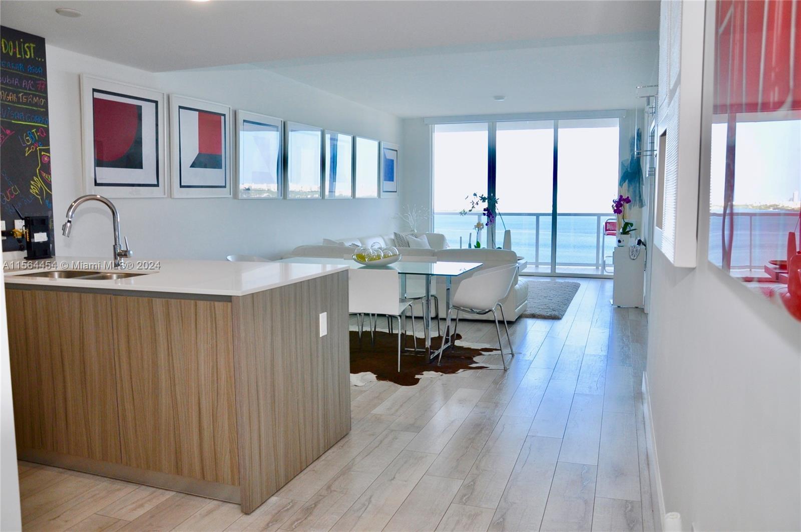 Luxury move-in ready 3 bedroom/3 bathroom condo with amazing open bay views, wood flooring throughou