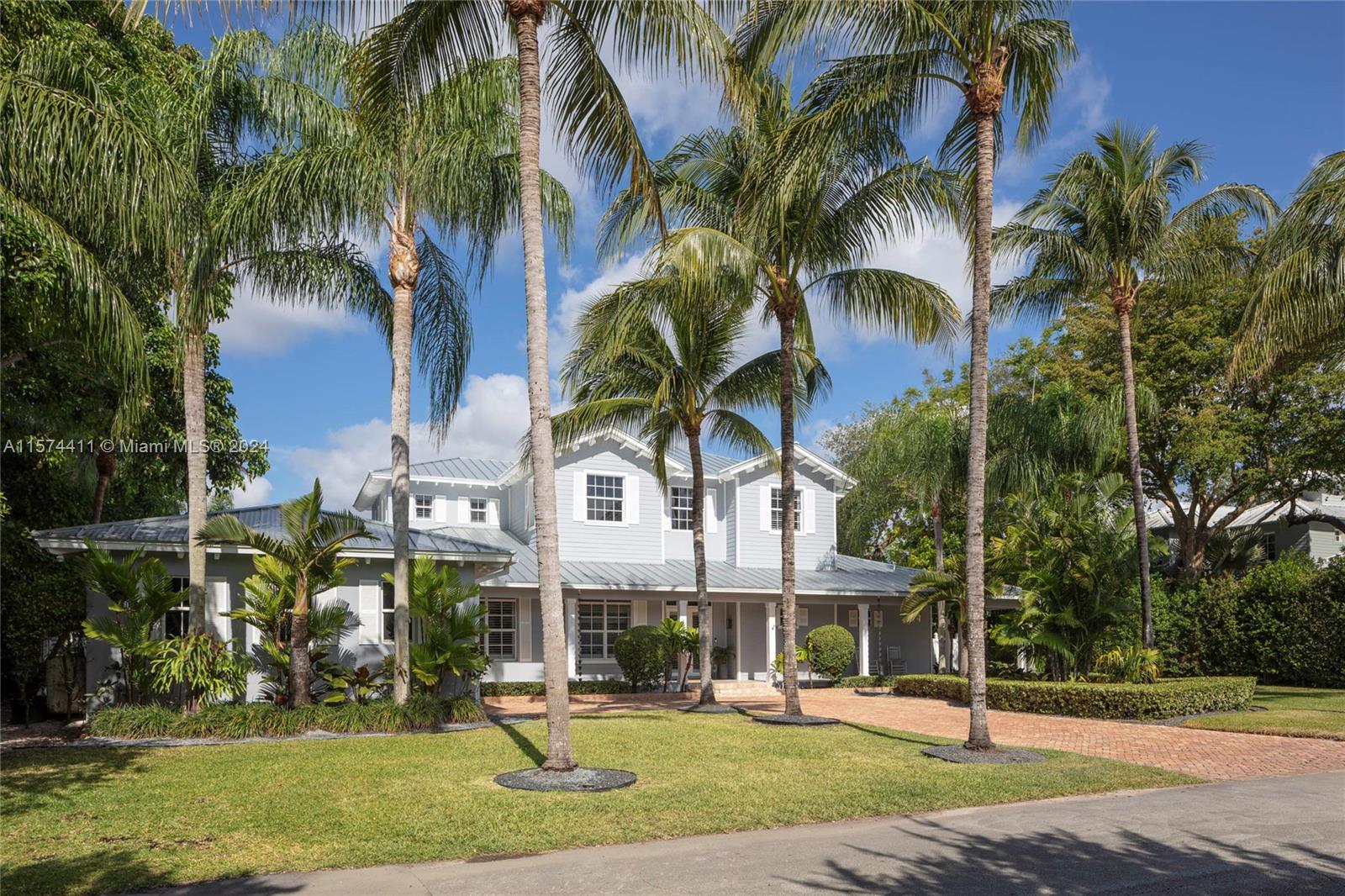 A special Key West estate on a beautiful canal-front block in the heart of Pinecrest. This home exud