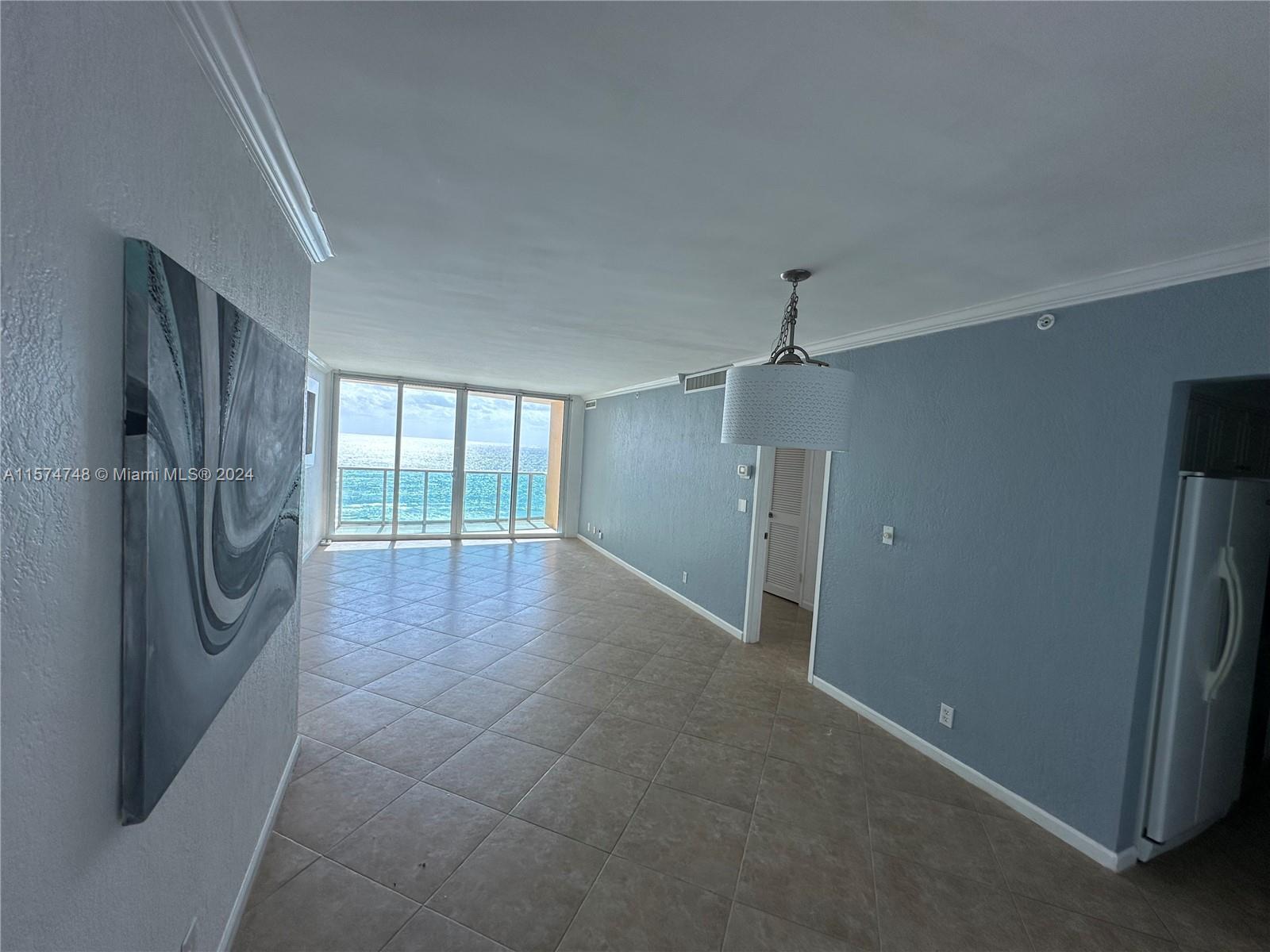 Spectacular 1 bedroom 1.5 bath DIRECT OCEANFRONT unit. Impact windows and sliding doors open up to a