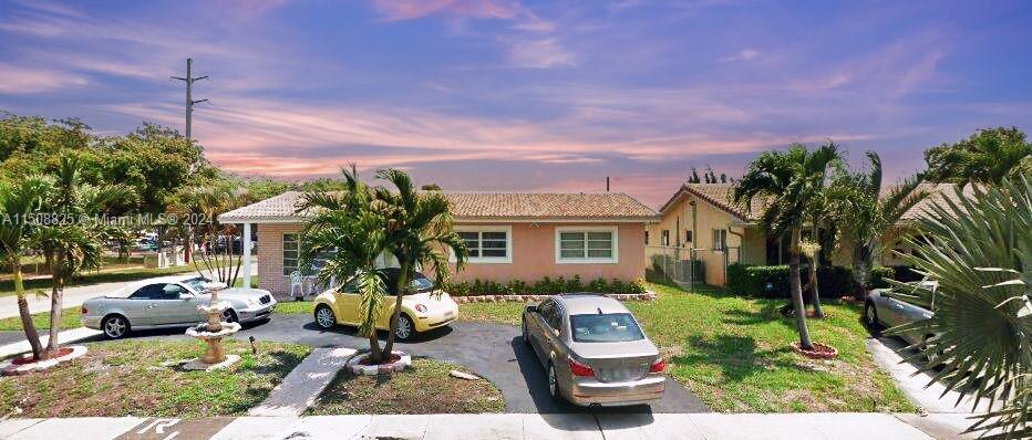 Great Hollywood East location. Corner lot with a circular driveway, new hurricane impact windows, an