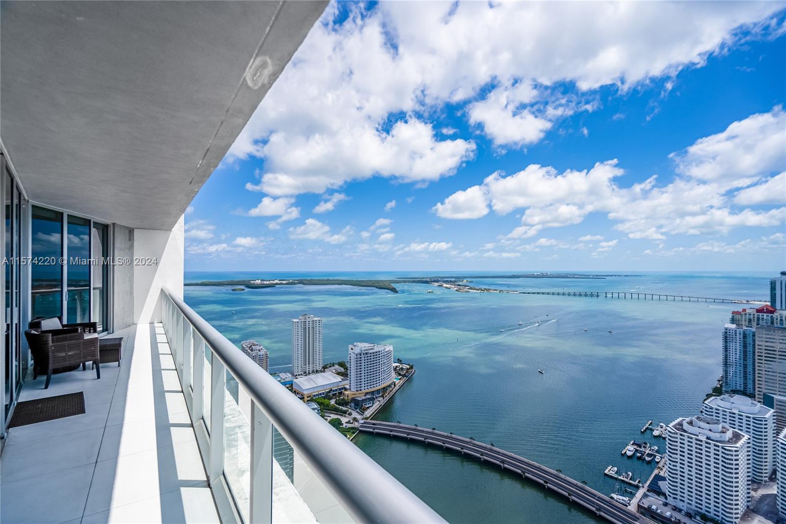 This stunning 2-bedroom plus den condo on the 54th floor offers a breathtaking panorama of the bay a
