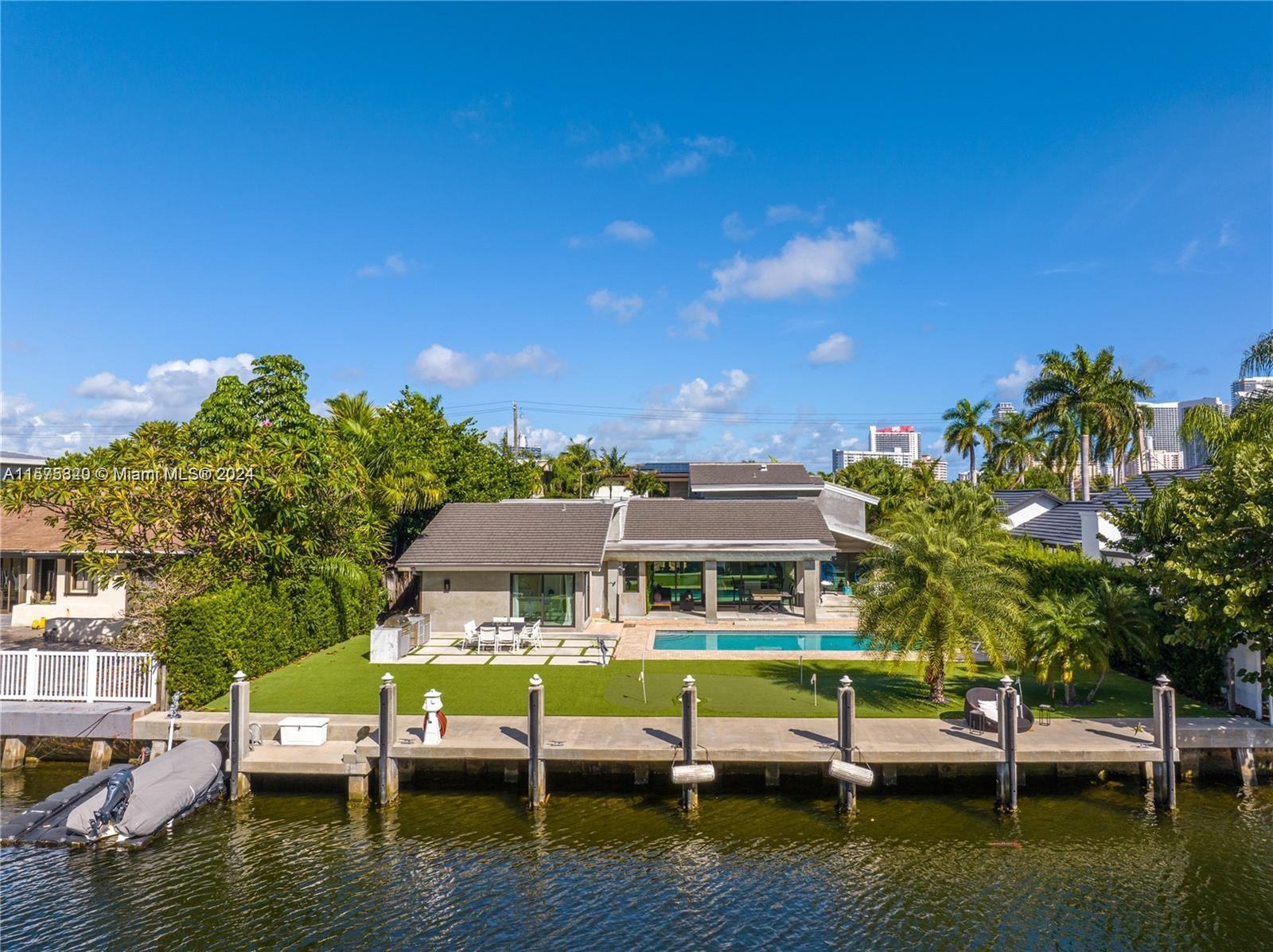 Beautiful waterfront home in one of the most desirable areas of Hallandale Beach. 100" boat dock wit