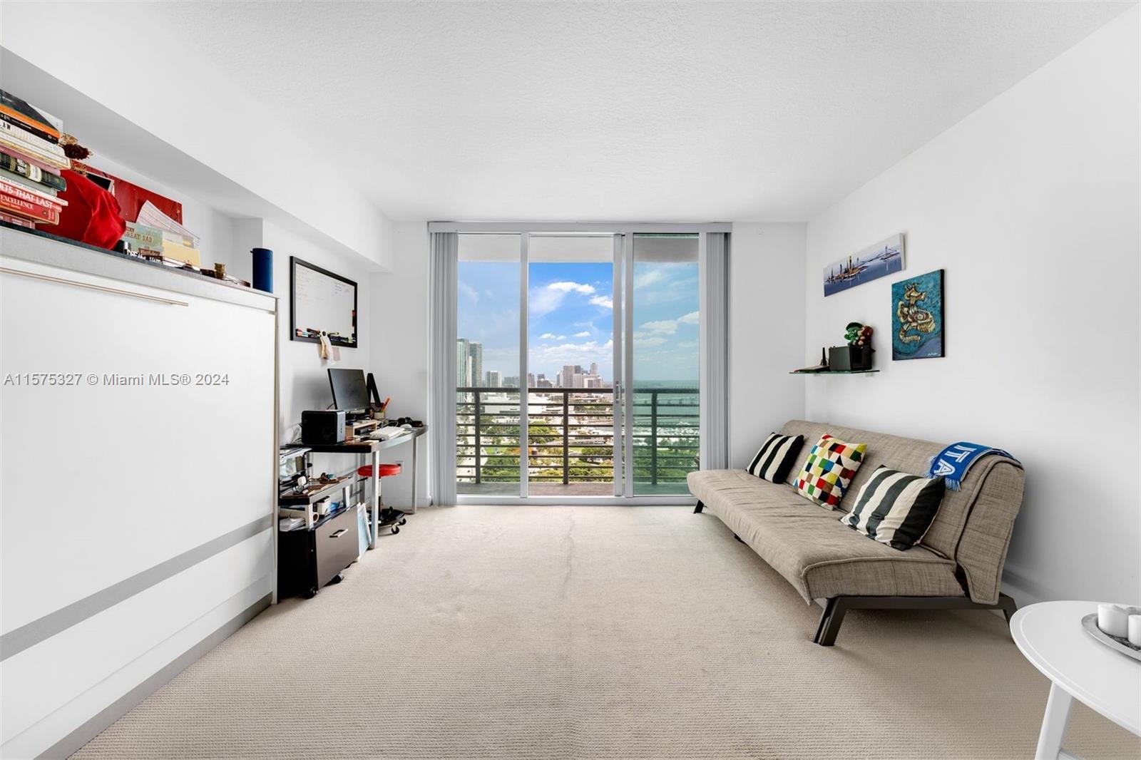 A beautiful studio at One Miami West with 507 interior square feet, a balcony, granite countertops, 