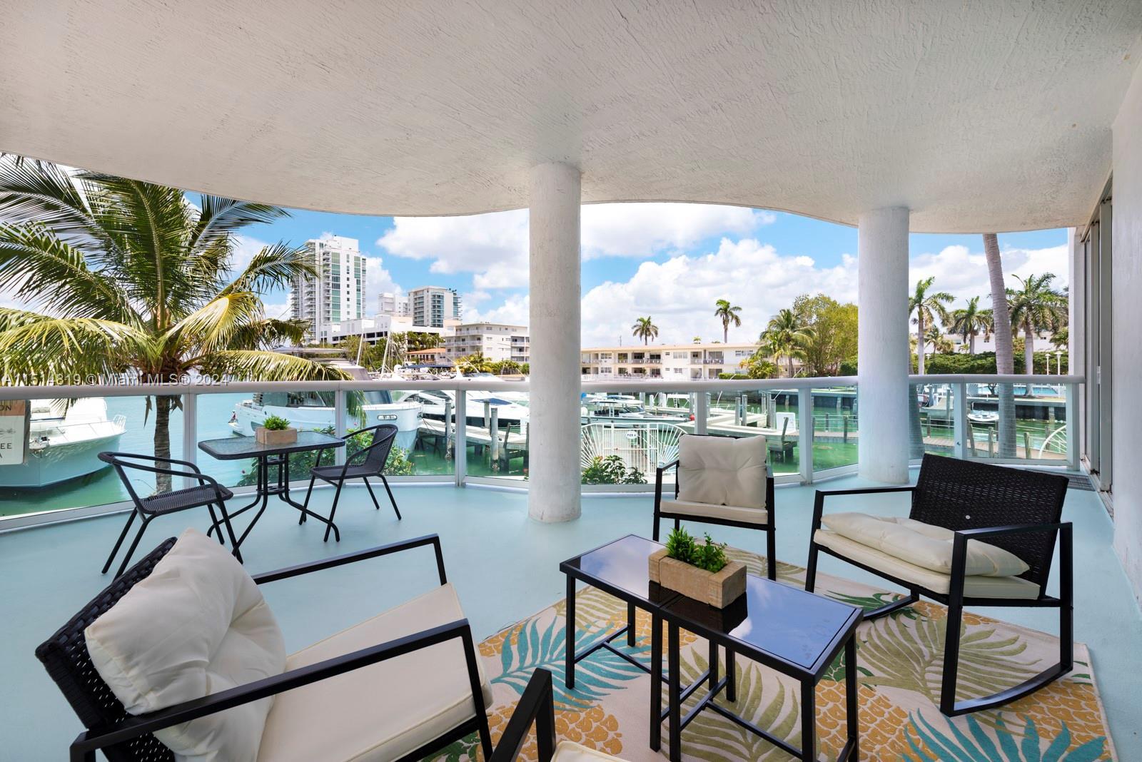Experience the epitome of marina living with this rare corner unit boasting a spectacular 180 degree