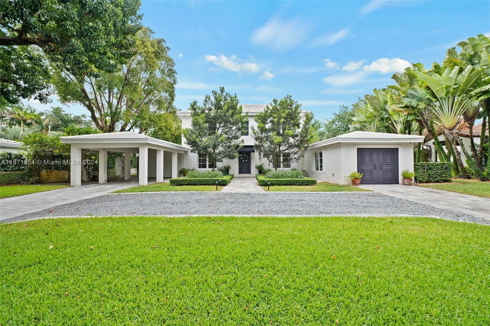 Timeless French-inspired residence, in the Italian Village, where a beautifully manicured front lawn