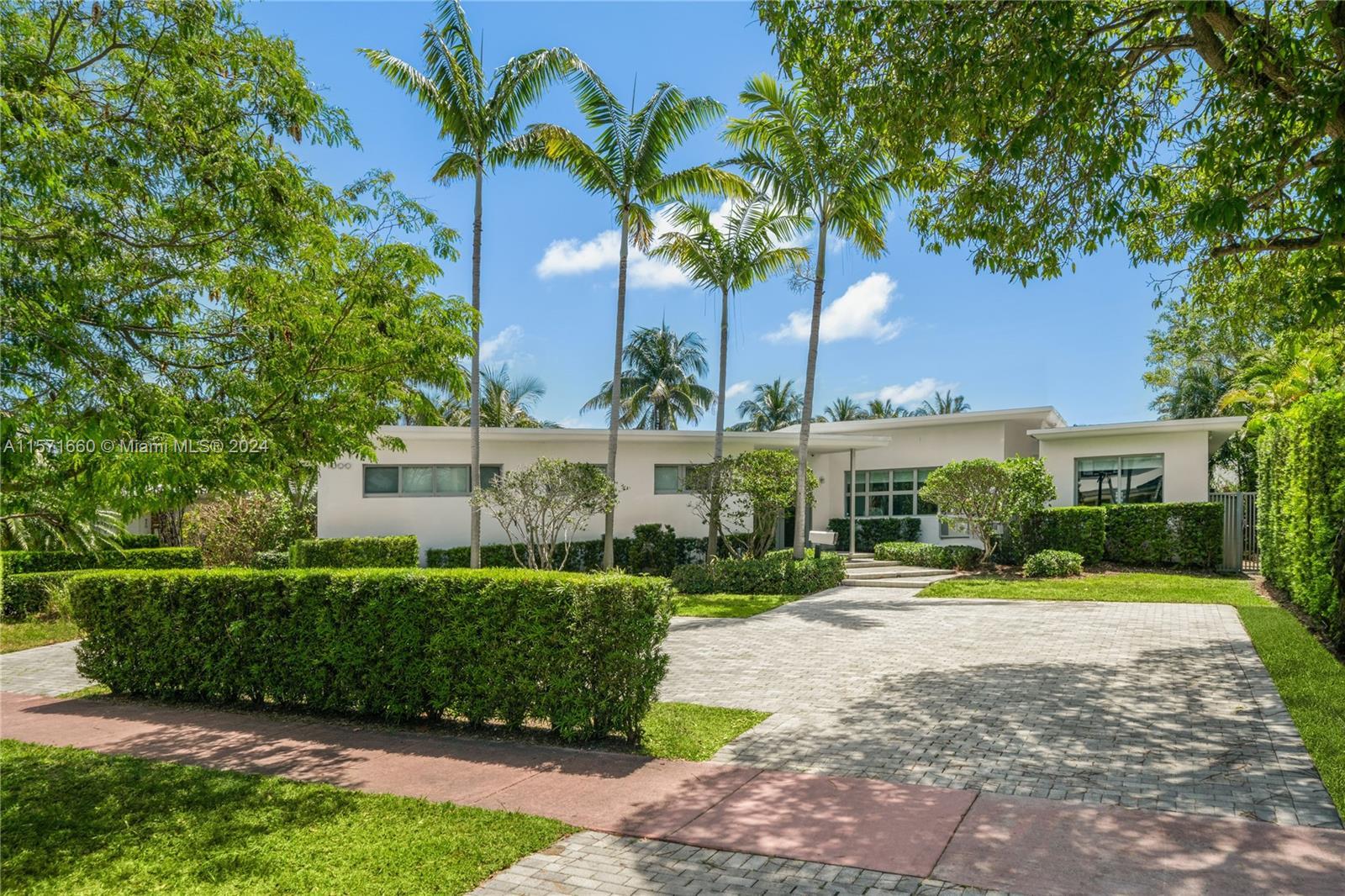 Tucked away inside the guard gated island of Normandy Shores, this home is the epitome of a timeless
