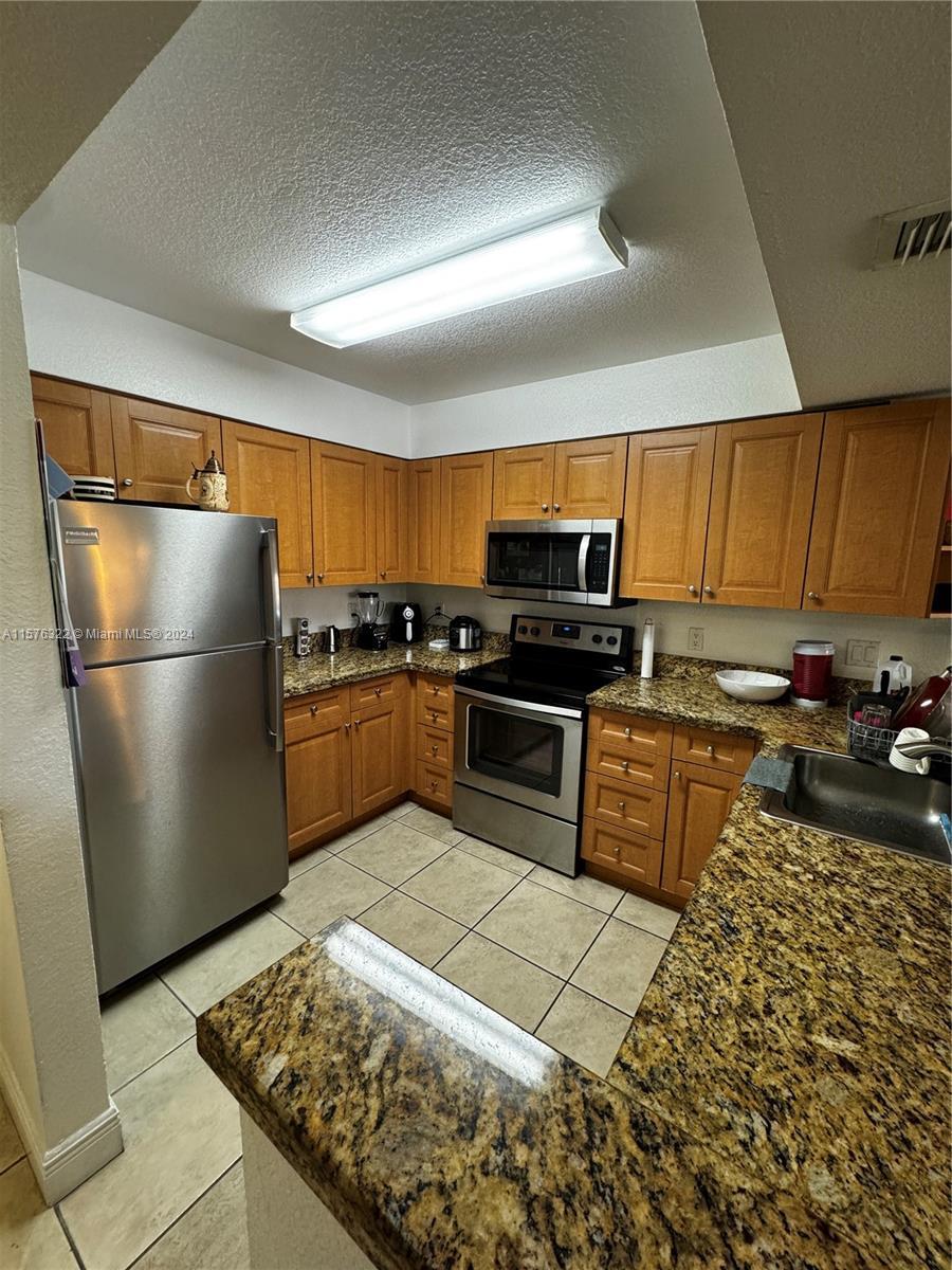 LOCATION LOCATION!! Welcome to your next home in the heart of Doral, Florida! This corner 2/2 unit o