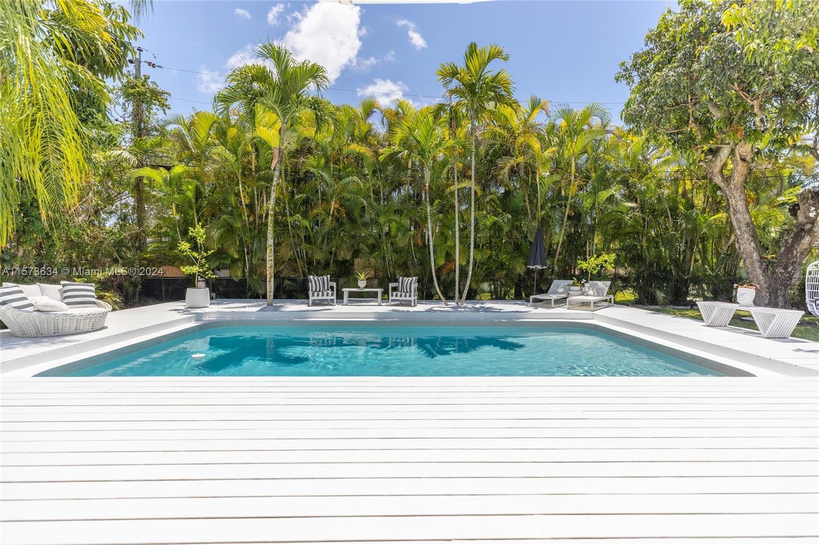 Key West-style home situated in the picturesque surroundings of Miami Shores. Nestled on a spacious 