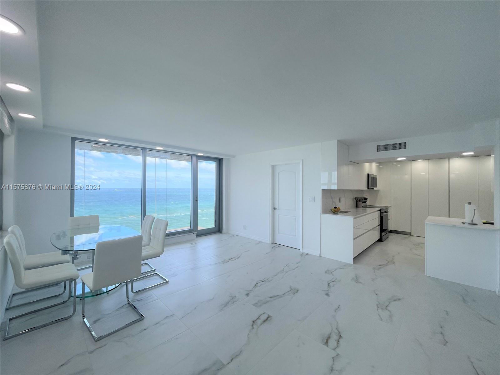 Completely renovated corner unit with direct ocean views, boasting a spacious 1955 sqft of living sp