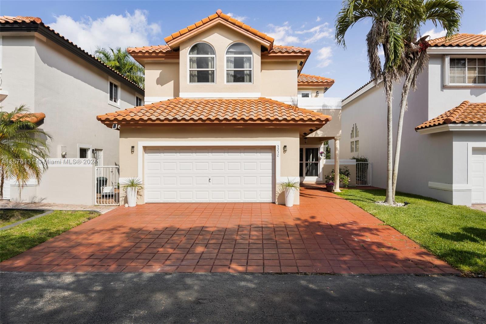 This stunning, furnished single-family home in gated Doral Palms Estates boasts modern elegance and 