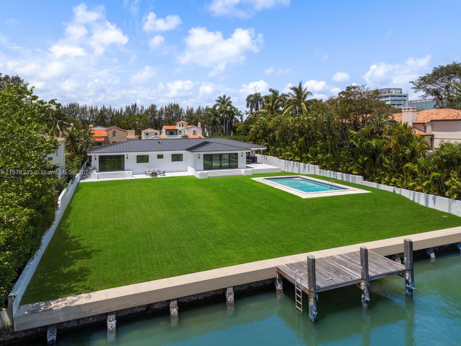This estate is a stunning blend of luxury and modern elegance, sitting on an expansive 25,100 sf lot