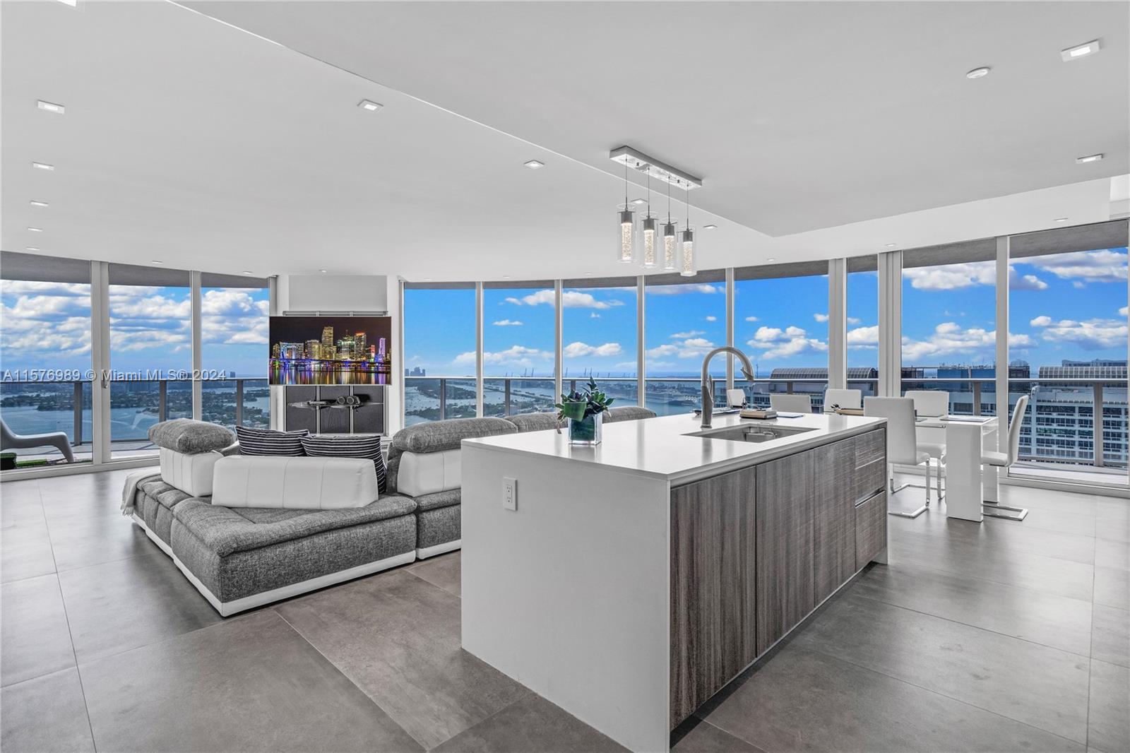 This luxurious corner unit on the 39th floor at Aria On The Bay boasts breathtaking direct water and