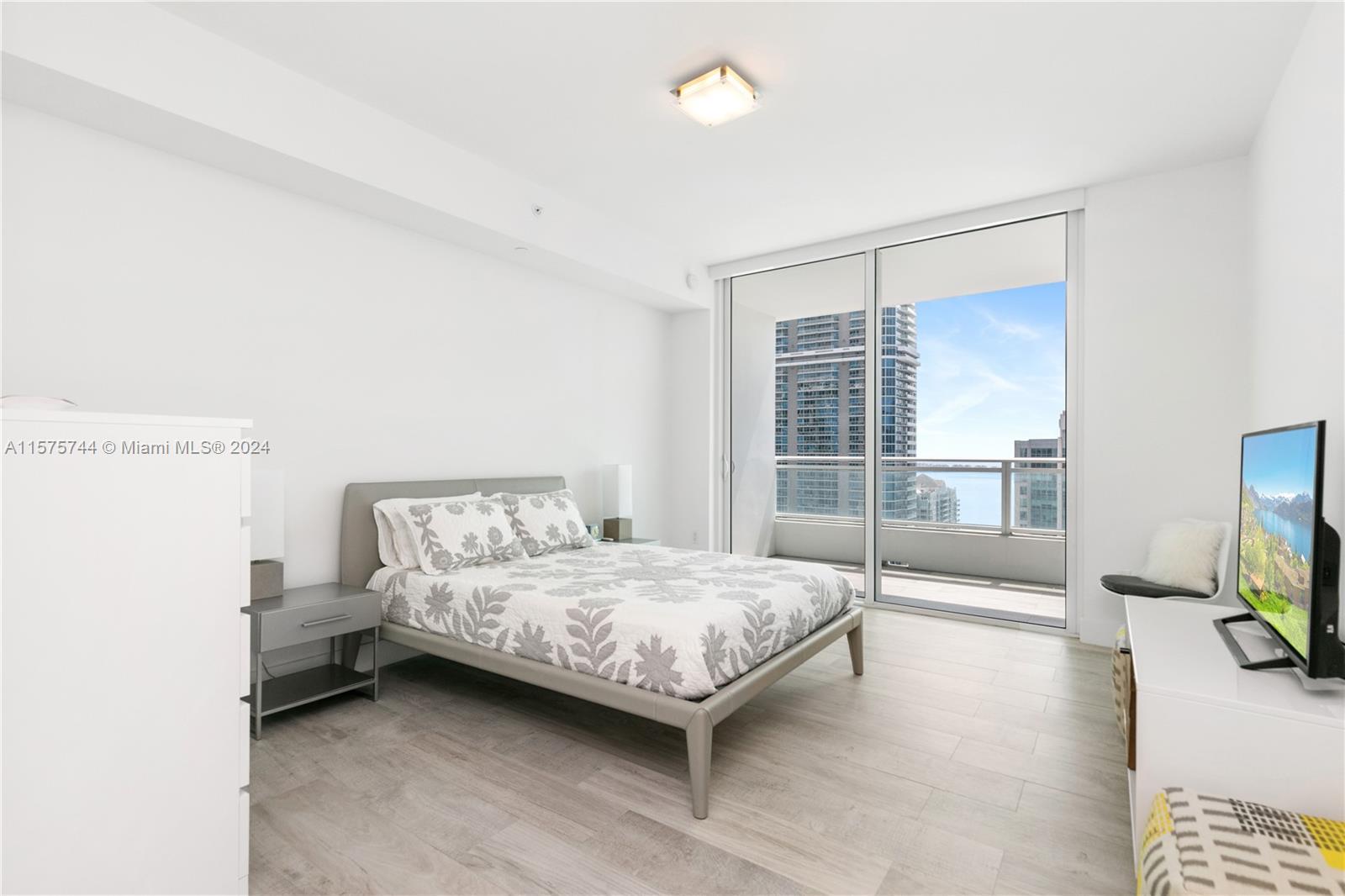 Beautiful One Bedroom Looking Brickell ave with some partial water views!!! . The Bond's British gla