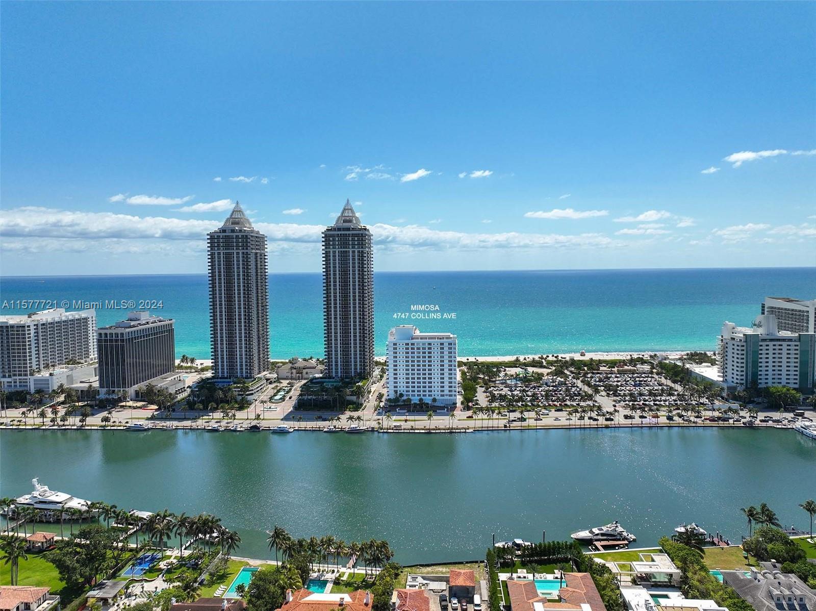 Live the dream on Miami Beach's sandy shores! This corner unit offers a fantastic layout flooded wit