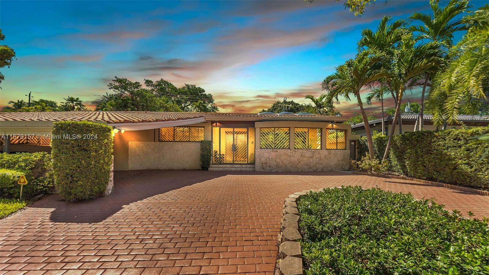 Nestled within the sought-after Bay Heights enclave, this gated residence epitomizes the allure of M
