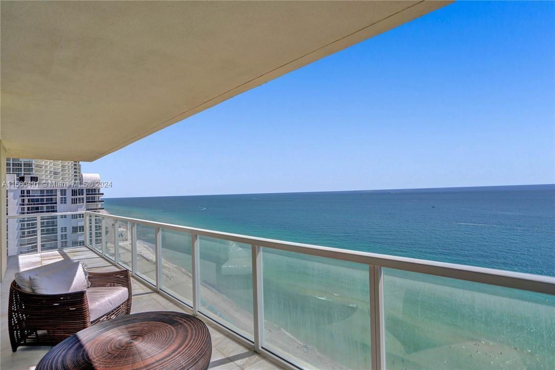 Experience breathtaking oceanfront living with unobstructed, floor-to-ceiling views of the ocean fro