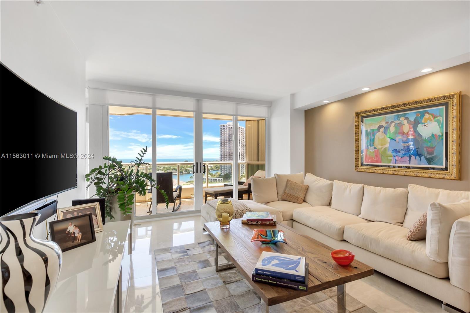 TURN-KEY UPDATED 2 BEDROOM + DEN UNIT WITH A MAGNIFICENT INTRACOASTAL AND OCEAN VIEWS FROM THE ENTIR