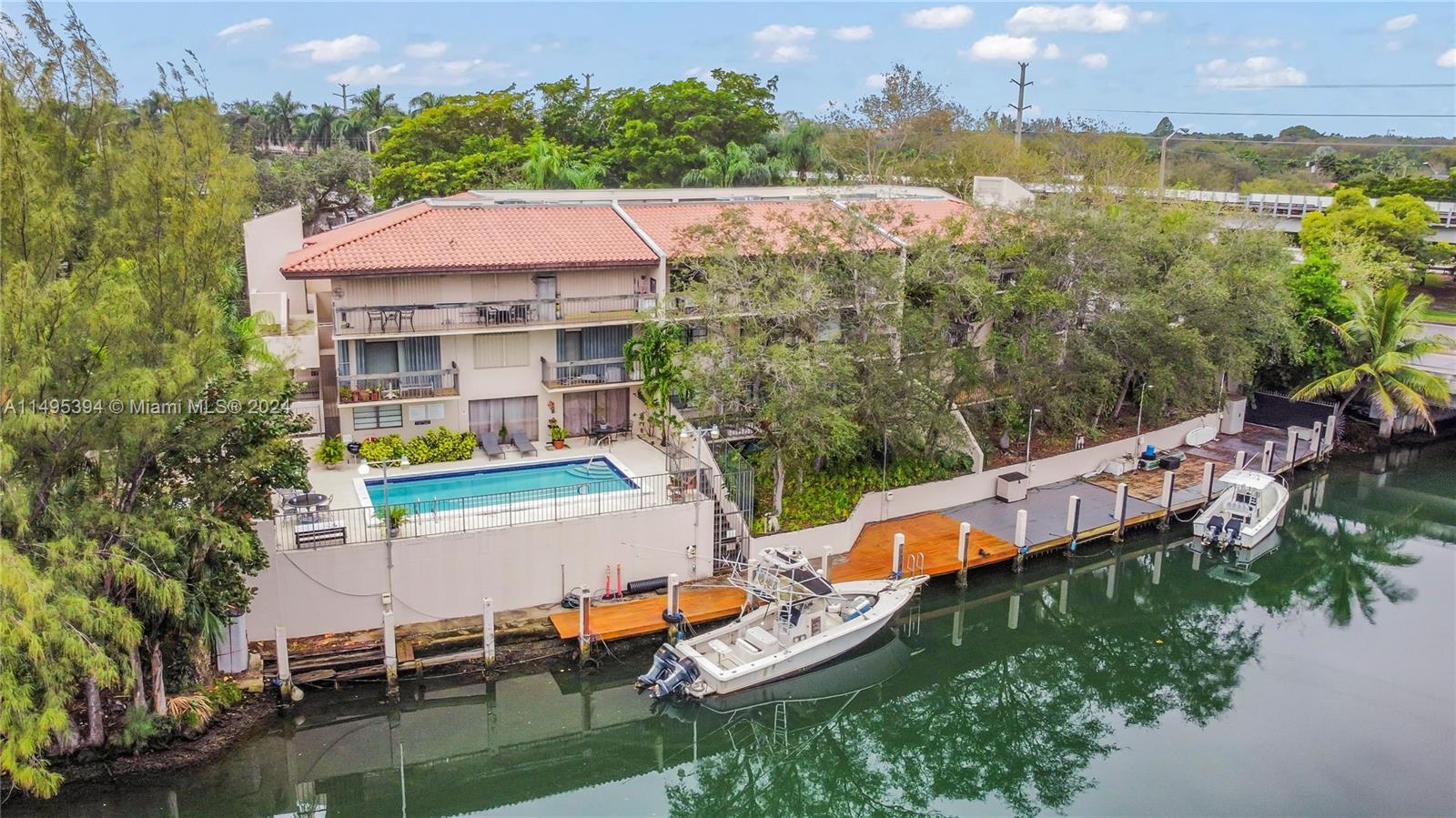 Deeded dock for boaters & 2 bedroom 2 bath condo on prestigious Coral Gables property. Unit features