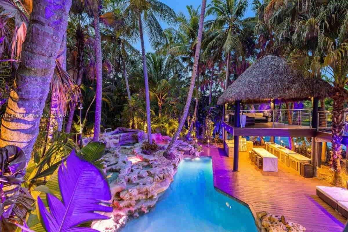 Beautiful entertainers dream home! This tropical oasis sits on a builders acre with all the amenitie