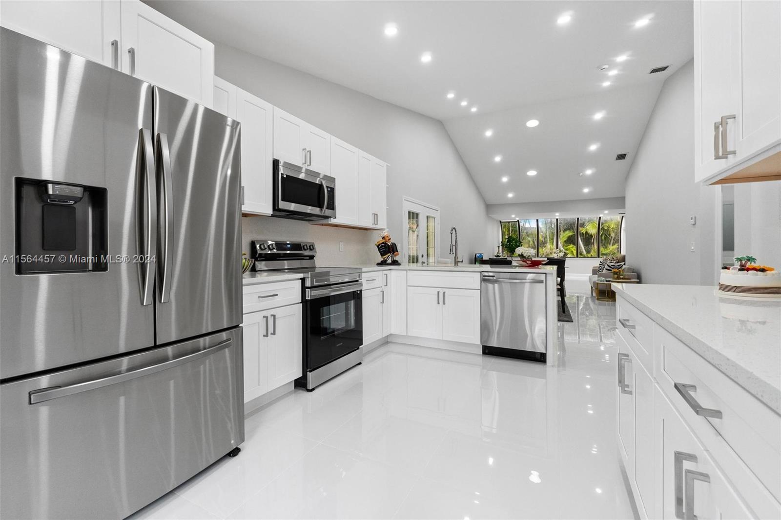 Exquisitely renovated home featuring luxury porcelain tile  flooring, a pristine white kitchen adorn