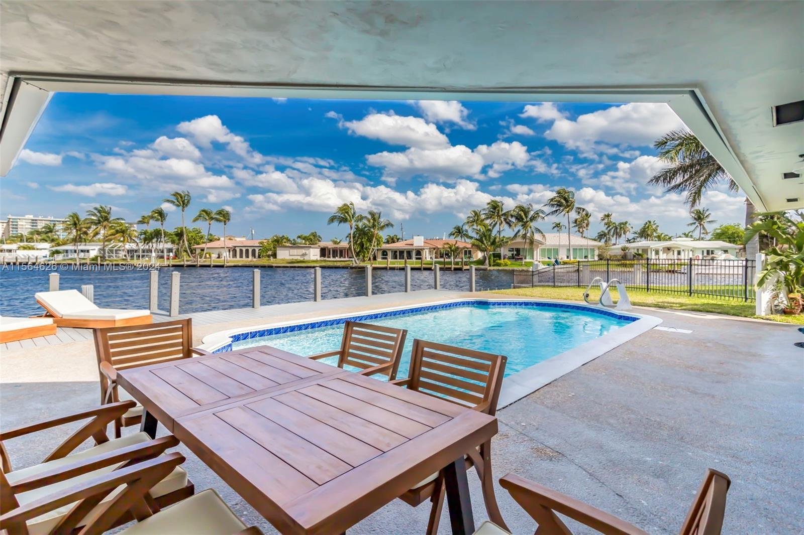 Tastefully renovated Waterfront Home on a canal in Pompano Beach with expansive Water Views, 110 fee