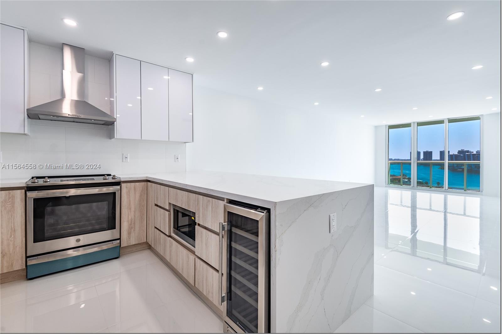 Experience luxury living in the prestigious Ocean View building in Sunny Isles Beach! This stunning 