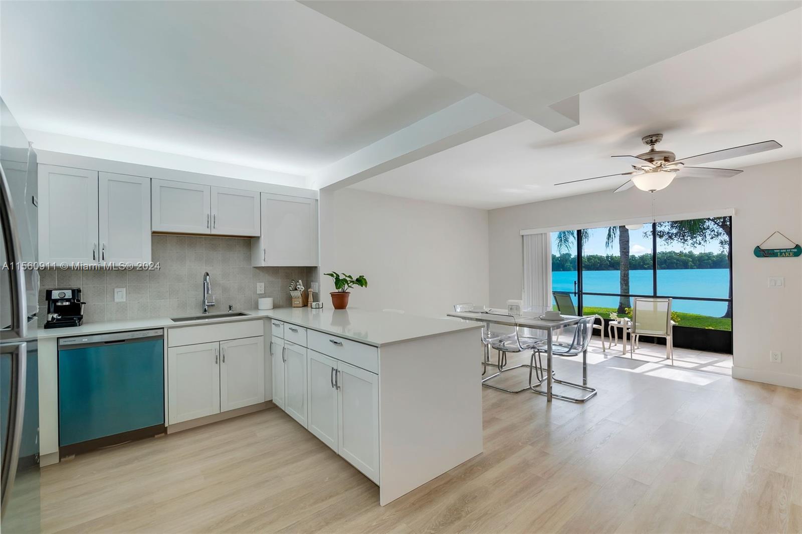 This fully renovated direct lakefront 2/2 + den unit is a masterpiece, featuring new modern flooring
