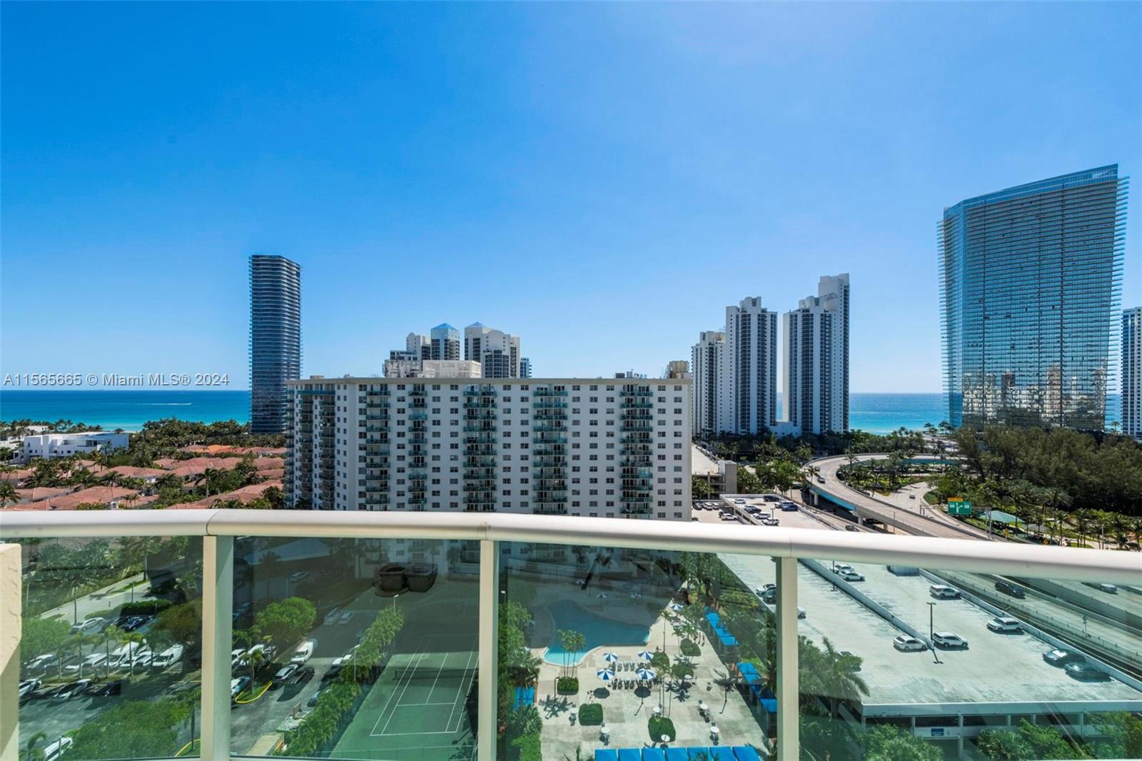Experience luxury beachfront living in this renovated penthouse boasting endless ocean views, spanni