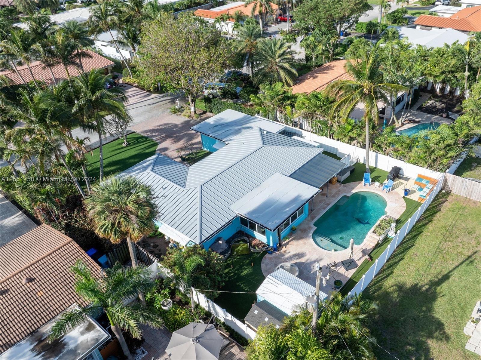 Spacious pool home in sought-after Bel-Air situated in charming beach town.New metal roof, flat roof