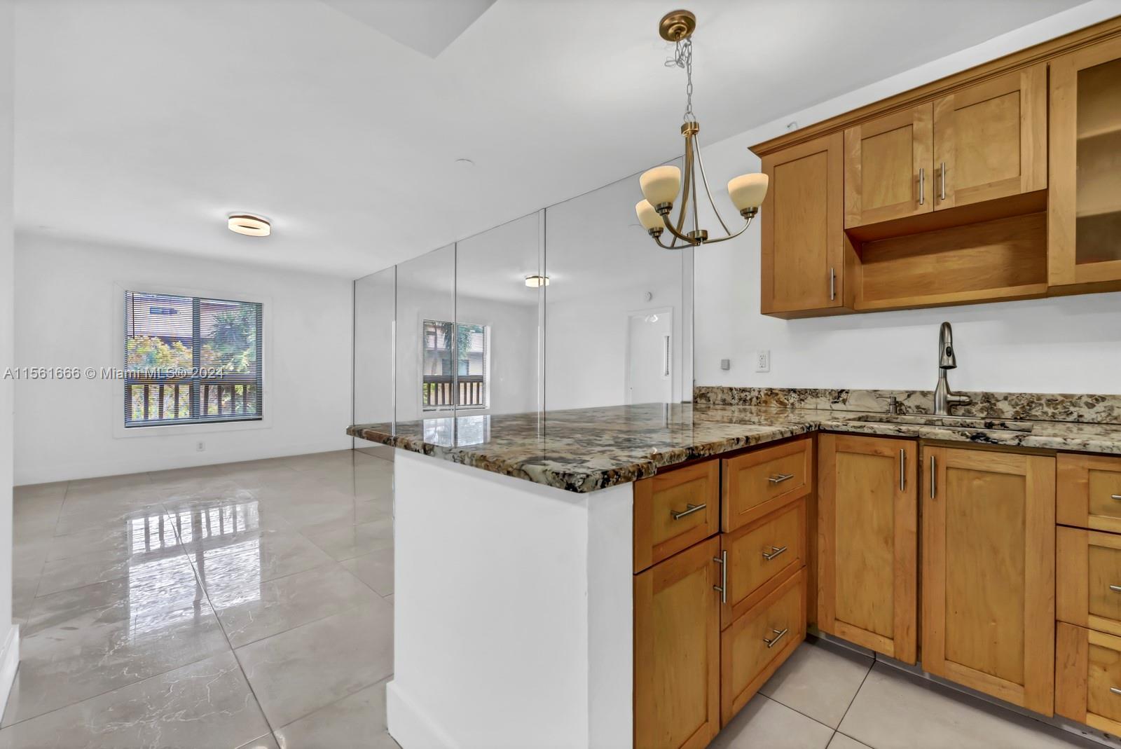 This condominium is a fantastic find! Located between Wilton Drive and Oakland Park's downtown enter