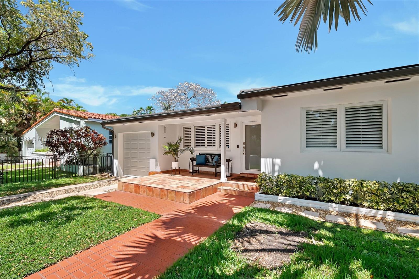 Discover Coral Gables charm in this enchanting home, where a blend of traditional allure and modern 