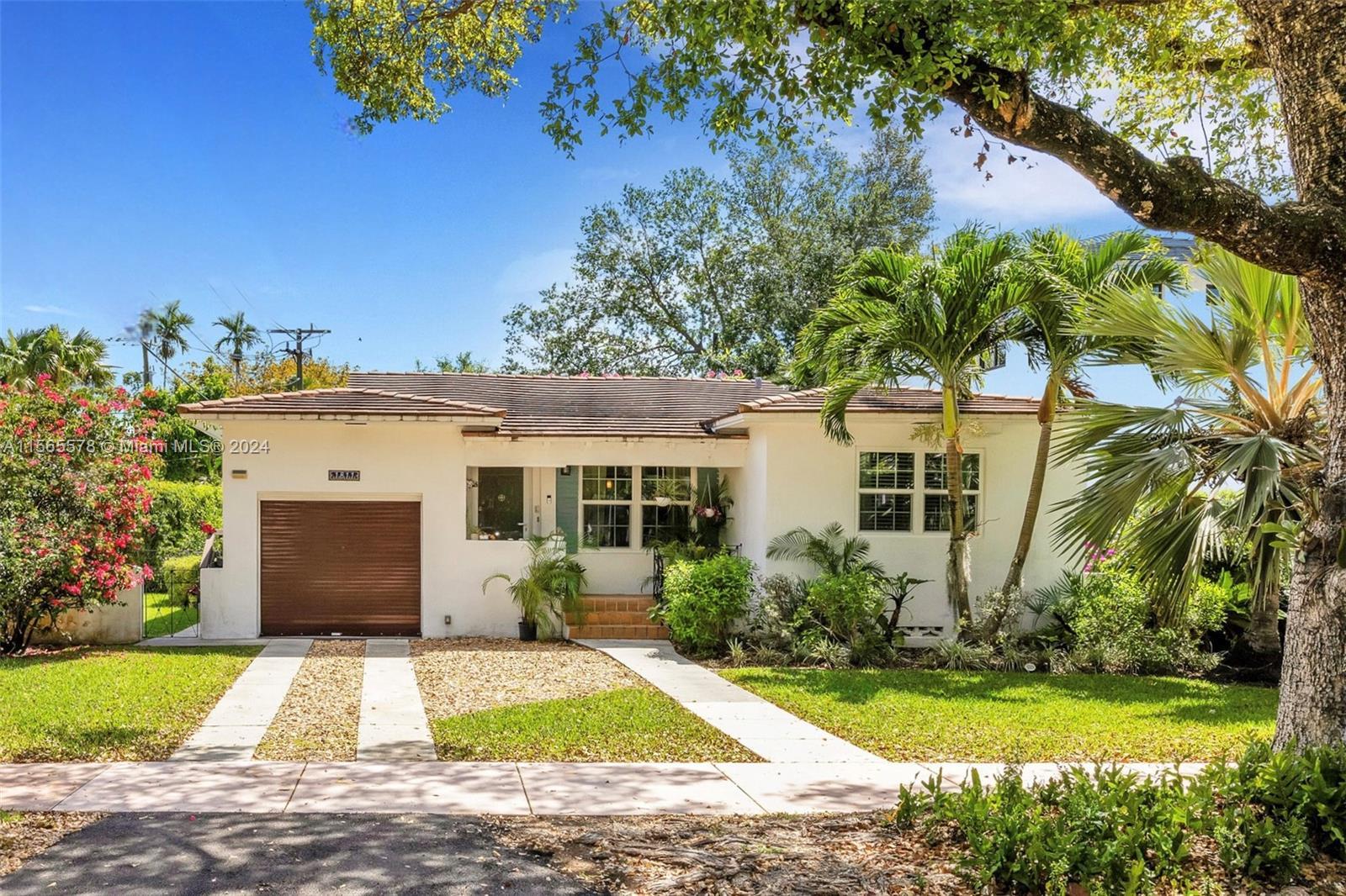 Nestled in Coral Gables, this charming 2 bedroom, 2 bathroom home exudes warmth with its timeless wo