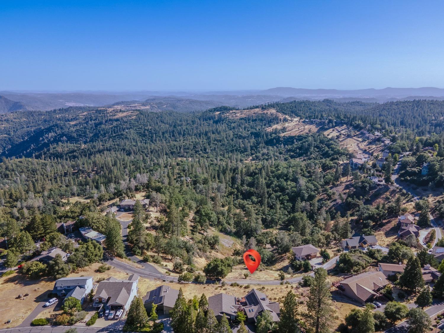 Views and location! This oversized 1.08 acre lot features stunning views of the Stanislaus Valley River Canyon, is located in the gated community of Forest Meadows (just minutes from downtown Murphys, wineries...or a short drive to skiing, hiking or boating) and is within walking distance to Hilltop Park amenities. FMOA amenities include: buried utilities, public water/sewer, security gate/patrols, clubhouse, two parks, pools, tennis/pickleball/bocce courts, playgrounds, dog park, trails and so much more.
