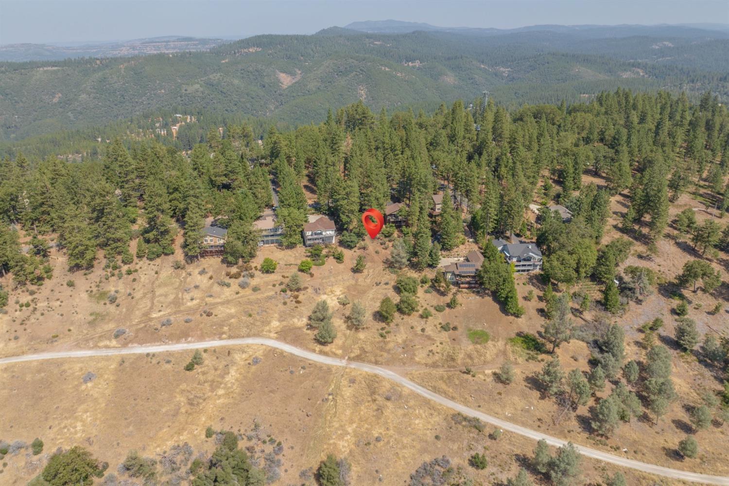 VIEWS! This beautiful .27 acre lot nestled in the trees features amazing panoramic views of the Stanislaus Valley River Canyon. Located in the gated community of Forest Meadows. Just minutes from downtown Murphys and wineries and golf (or a short drive to lakes, Calaveras Big Trees State Park or skiing). Lot includes plans for a 2,162sf open concept main floor 3 bedroom/2 bathmountain house. Plus, an unfinished 1321sf basement plan for 4-planned rooms (4-window studio, 2-window workshop, storage area and 1/2 bath). Community amenities include: security gate/patrols, underground utilities available, common area maintenance, snowplowing of main roads, clubhouse, 2 pools & parks, tennis/pickle-ball/basketball/bocce courts, playgrounds, dog park, walking/hiking trails...and so much more.