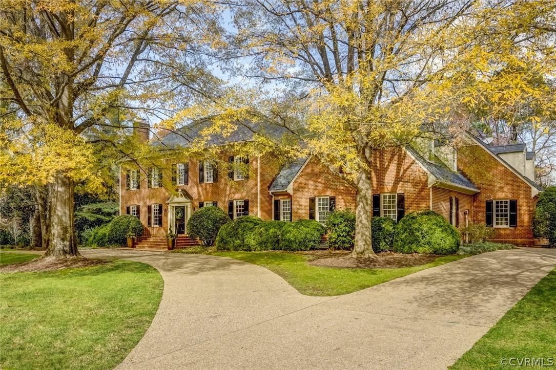 Majestic brick Georgian with distinctive circular driveway is sited on one of Riverlake Colony’s pre