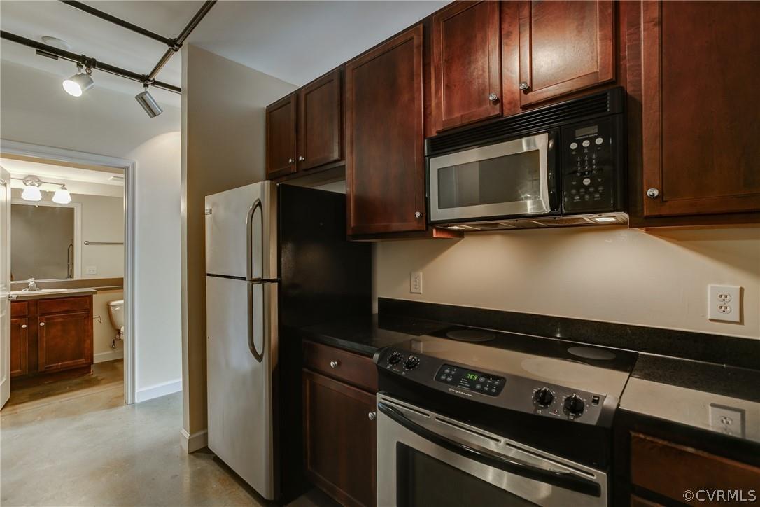 Spacious Loft with many distinctive features to include granite, high ceilings, exposed brick, stain