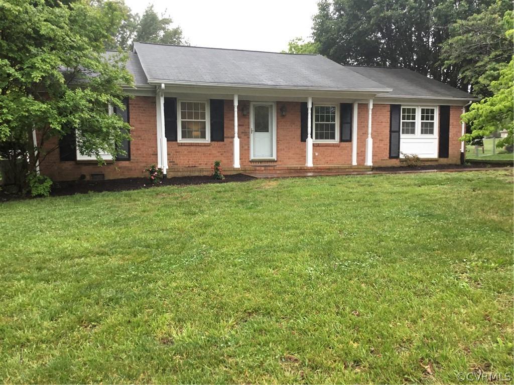 Putting the finishing touches on this lovely  three bedroom, two bath BRICK  ranch located close to 